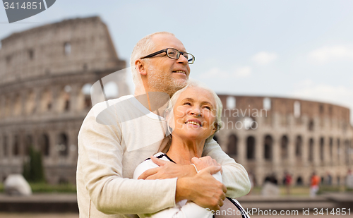 Image of happy senior couple over coliseum in rome, italy