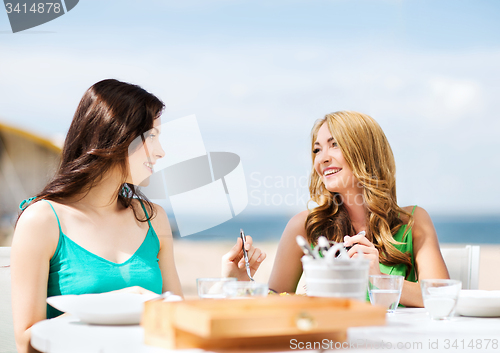 Image of girls in cafe on the beach