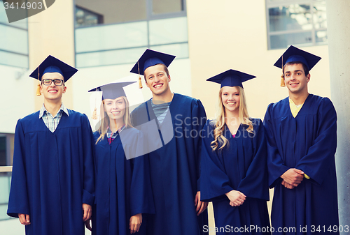 Image of group of smiling students in mortarboards