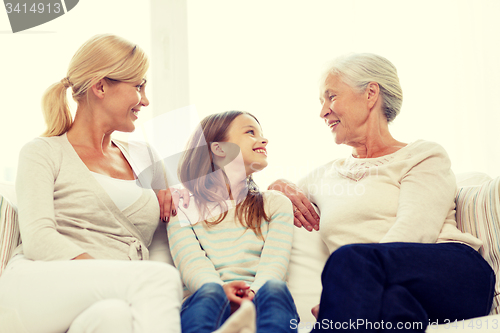 Image of smiling family at home