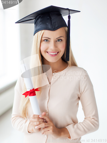 Image of student in graduation cap with certificate