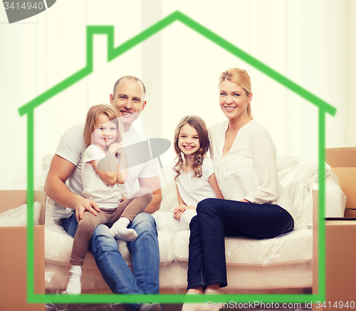 Image of smiling parents and two little girls at new home