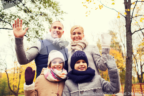 Image of happy family in autumn park