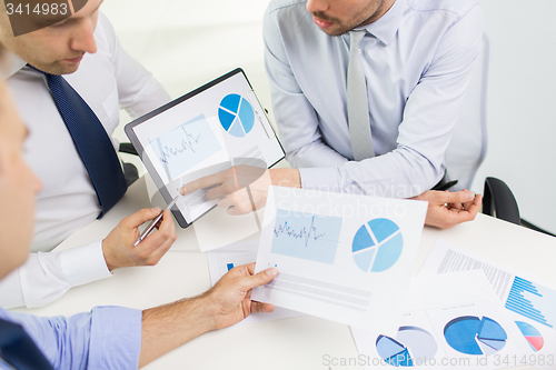 Image of close up of businessman hands with clipboard