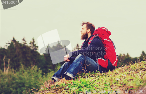 Image of man with backpack hiking