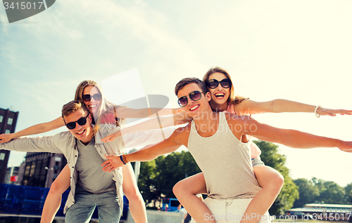 Image of smiling couple having fun in city