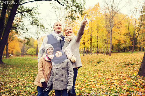 Image of happy family in autumn park