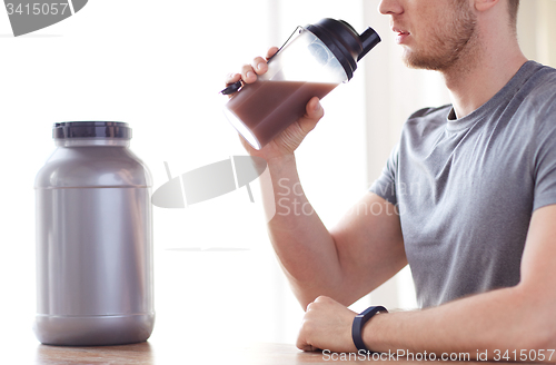 Image of close up of man drinking protein shake