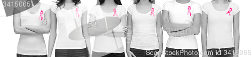 Image of smiling women with pink cancer awareness ribbons