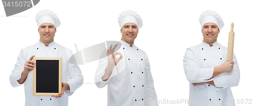 Image of happy male chef baker with menu board showing ok