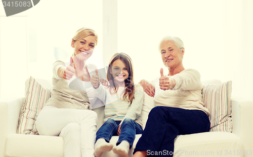 Image of smiling family at home