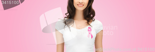 Image of smiling young woman with cancer awareness ribbon