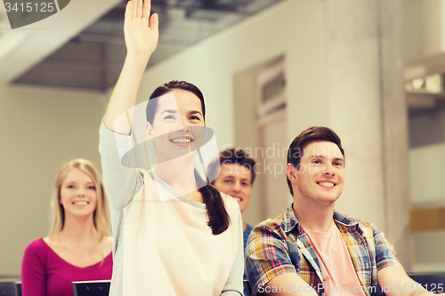 Image of group of smiling students in lecture hall