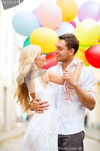 Image of couple with colorful balloons