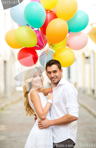 Image of couple with colorful balloons