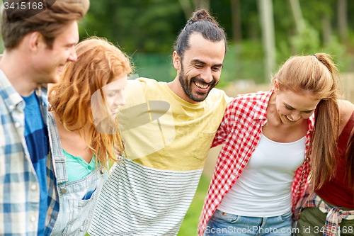 Image of group of smiling friends outdoors