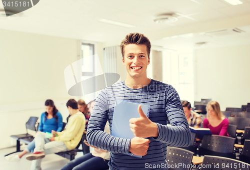 Image of group of smiling students in lecture hall