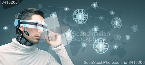 Image of man with futuristic 3d glasses and sensors