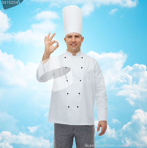 Image of happy male chef cook showing ok sign