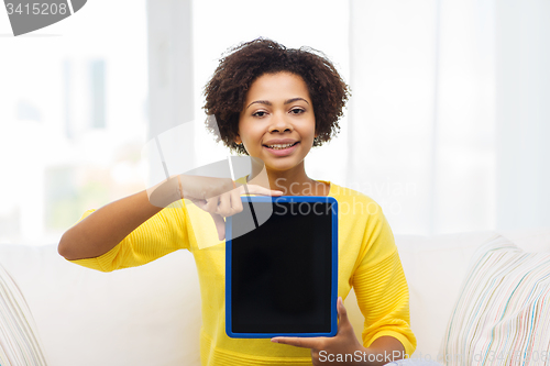 Image of happy african american woman with tablet pc