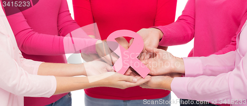 Image of close up of women with cancer awareness ribbons