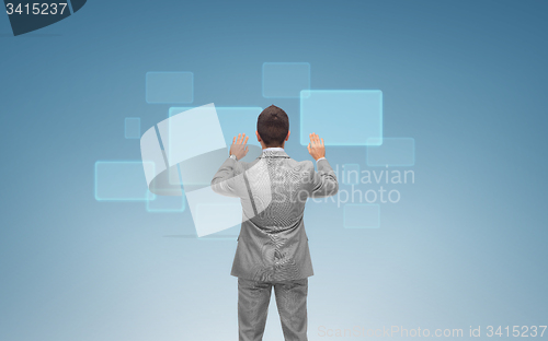 Image of businessman working with virtual screens