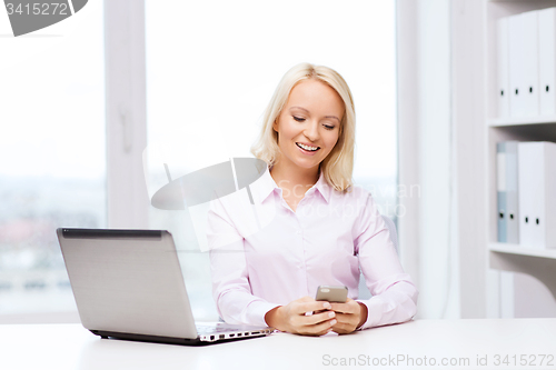 Image of smiling businesswoman or student with smartphone