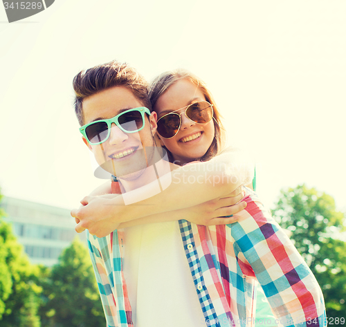 Image of smiling couple having fun in park
