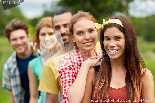 Image of group of smiling friends outdoors