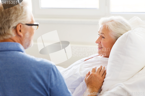 Image of senior couple meeting at hospital ward