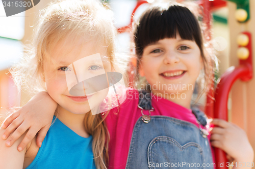 Image of group of happy little girls on children playground