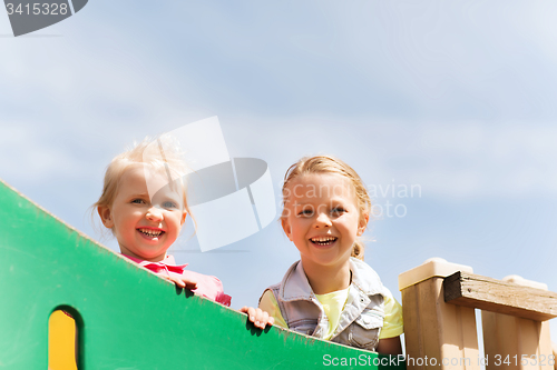 Image of happy little girls on children playground