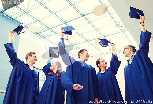 Image of group of smiling students in mortarboards