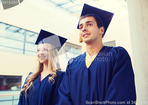 Image of group of smiling students in mortarboards