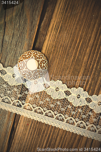 Image of vintage button and lace tape