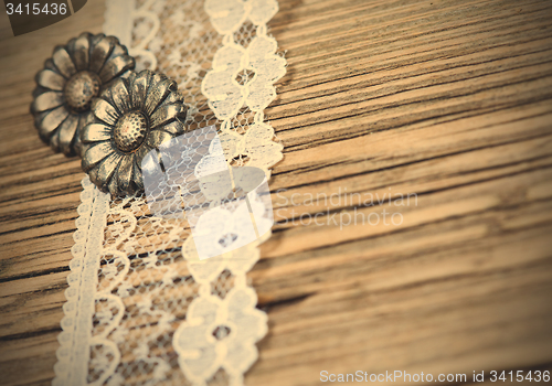 Image of vintage button and lace tape