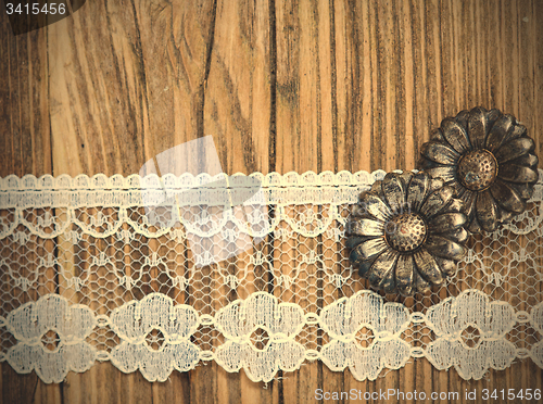 Image of vintage button and lace tape