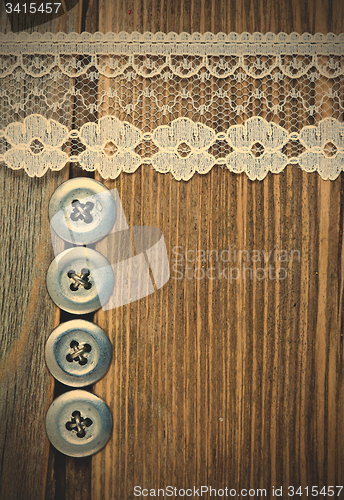 Image of vintage button and lace tape