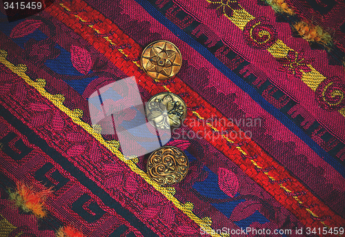 Image of vintage tape with embroidered ornaments and old buttons