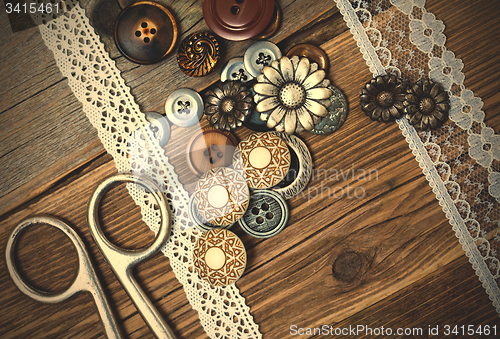 Image of vintage buttons, lace, and a dressmaker scissors