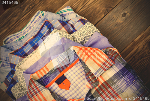 Image of bright shirts in a pile