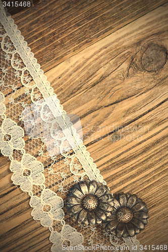 Image of vintage button and lace tape