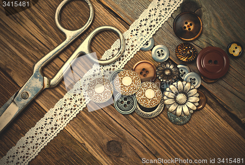 Image of vintage buttons, lace, and a dressmaker scissors