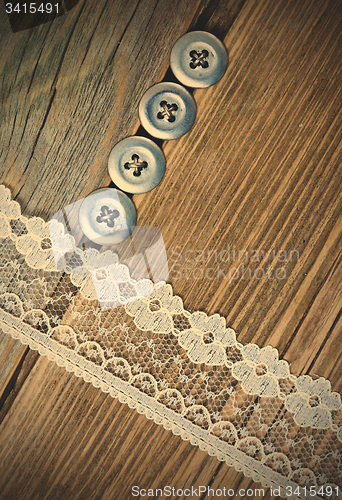 Image of vintage button and lace tape