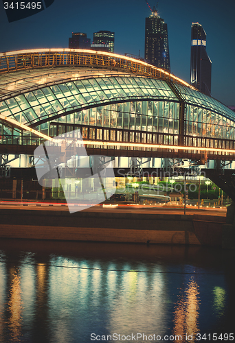 Image of Moscow night cityscape wint part of covered bridge