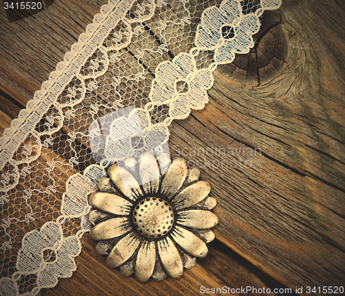 Image of vintage button and lace tape