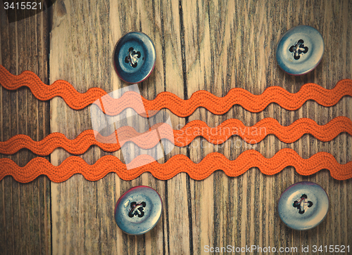 Image of vintage button and old band