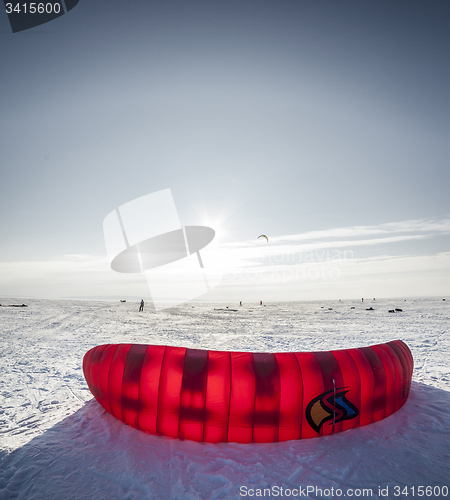 Image of Kiteboarder with kite on the snow