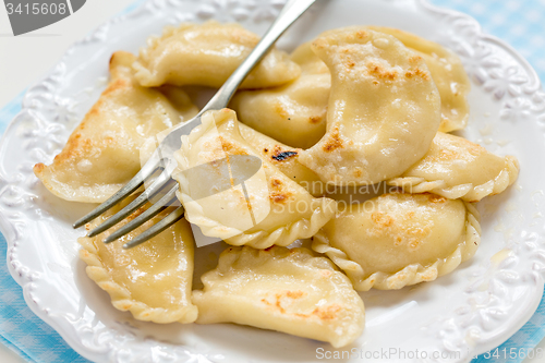 Image of Fried in butter dumplings with cottage cheese.