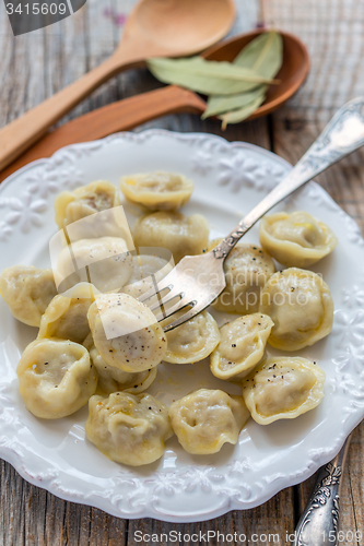 Image of Dumplings and fork on a plate.